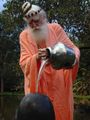 Gurudeva pouring Sivalingam.jpg